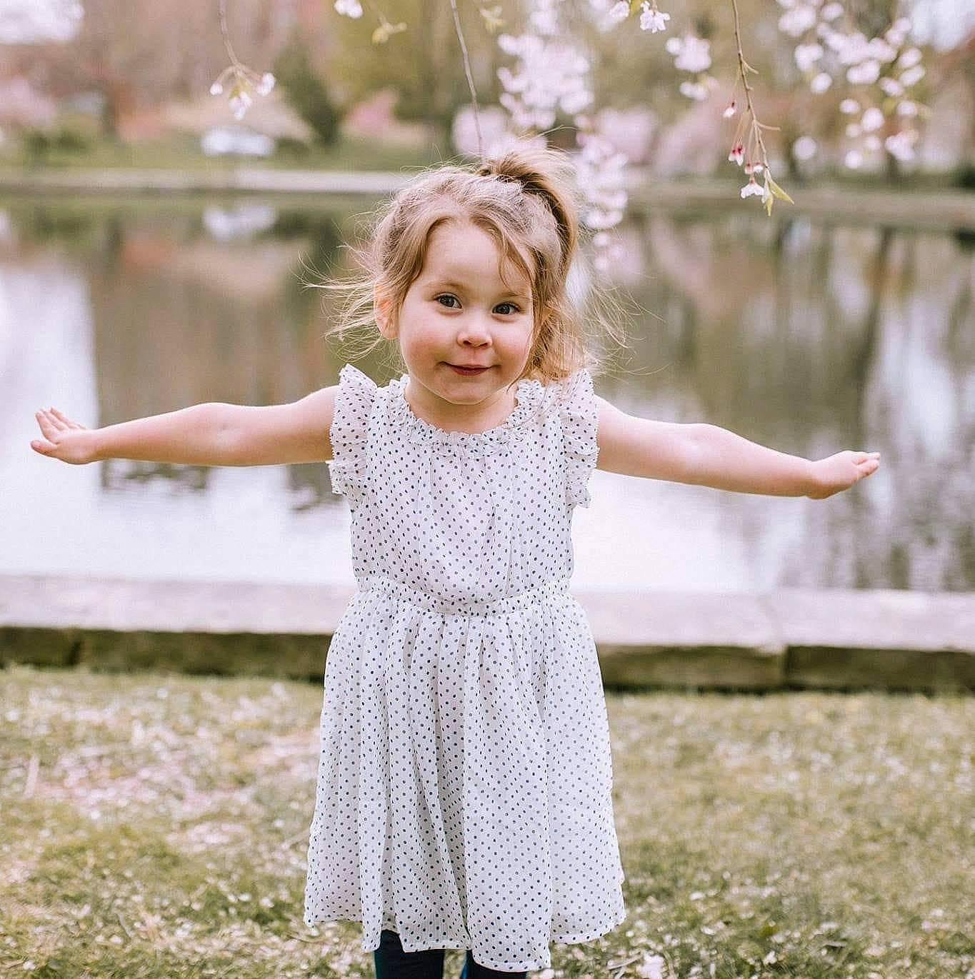 Amya joined the competition — help win amazing prizes! baby_toddler_clothing, beauty, blossom, child, child_model, day_dress, dress, embellishment, facial_expression, gesture, happy, joy, one_piece_garment, pattern, people_in_nature, person, portrait_photography, spring, summer, toddler
