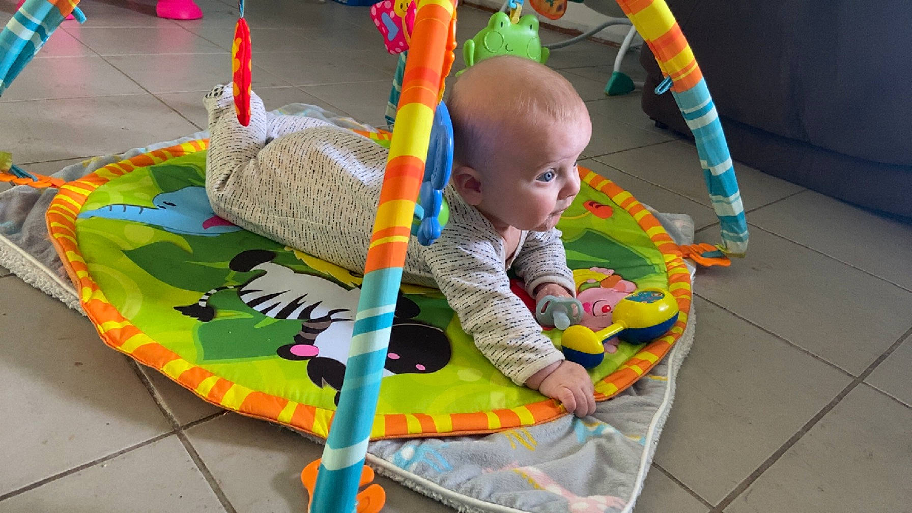 Noah is registered to the contest to win money with this photo: baby, baby_products, baby_toddler_clothing, baby_toys, child, comfort, event, fun, grass, leisure, person, play, room, sitting, toddler, toy