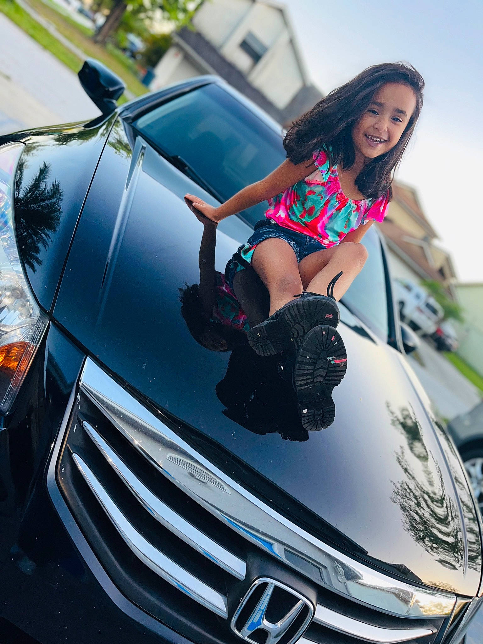 Isabella joined the competition — help win amazing prizes! automotive_design, automotive_exterior, automotive_lighting, black, bumper, car, dress, grille, hair, headlamp, hood, jeans, joy, leg, light, motor_vehicle, person, photograph, rim, vehicle