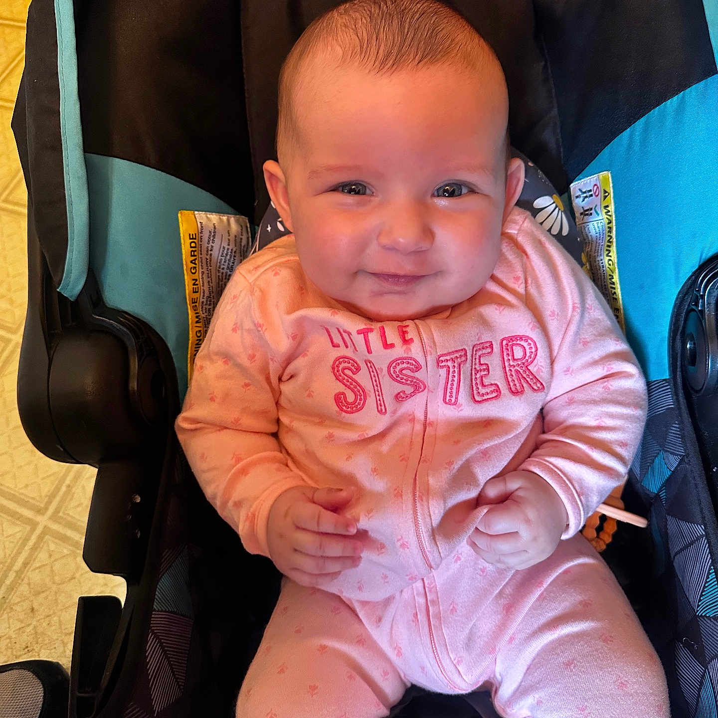 Isabella joined the competition — help win amazing prizes! baby, car, car_interior, clothing, cushion, face, footwear, happy, head, homedecor, pants, person, photography, portrait, shoe, smile, stroller, t_shirt, transportation, vehicle