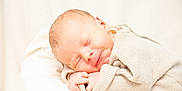 Aleks a rejoint le concours — aidez-le/la à gagner de superbes lots ! newborn, baby, sleeping, smile, cozy, sweater, infant, soft, white_background, peaceful, cute, resting, portrait, child, human, skin, closed_eyes, tiny_hands, warm, comfort