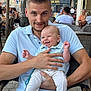 Aleks participe au concours pour gagner de l'argent avec cette photo : baby, cafe, casual, chair, child, clothing, daytime, expression, family, happy, holding, man, outdoor, pants, people, person, polo_shirt, smiling, table, urban