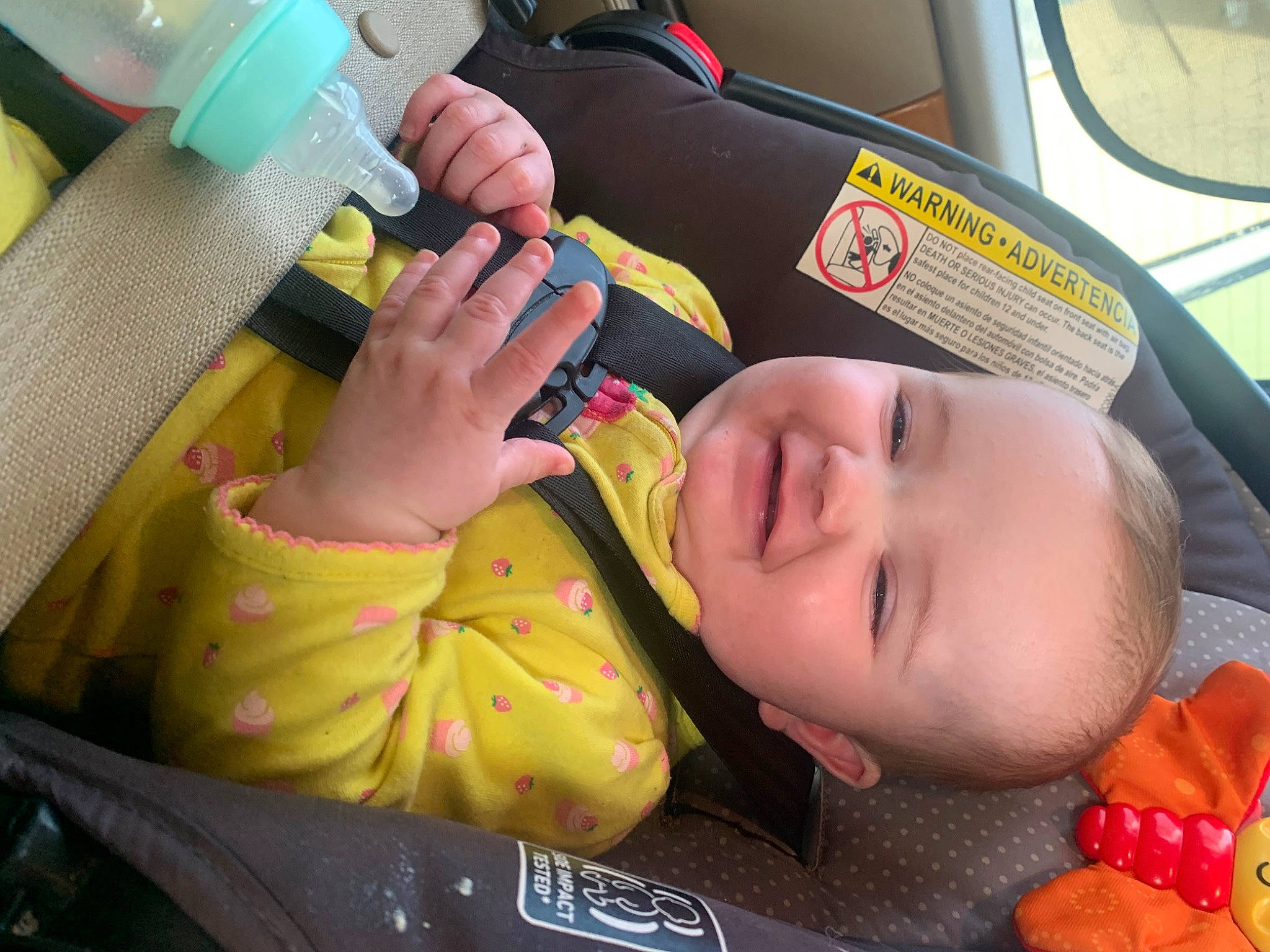 Addyson is registered to the contest to win money with this photo: baby, baby_products, baby_toddler_clothing, car_seat, child, comfort, family_car, fun, happy, mouth, nail, orange, person, skin, smile, steering_wheel, thumb, toddler, vehicle_door, windshield