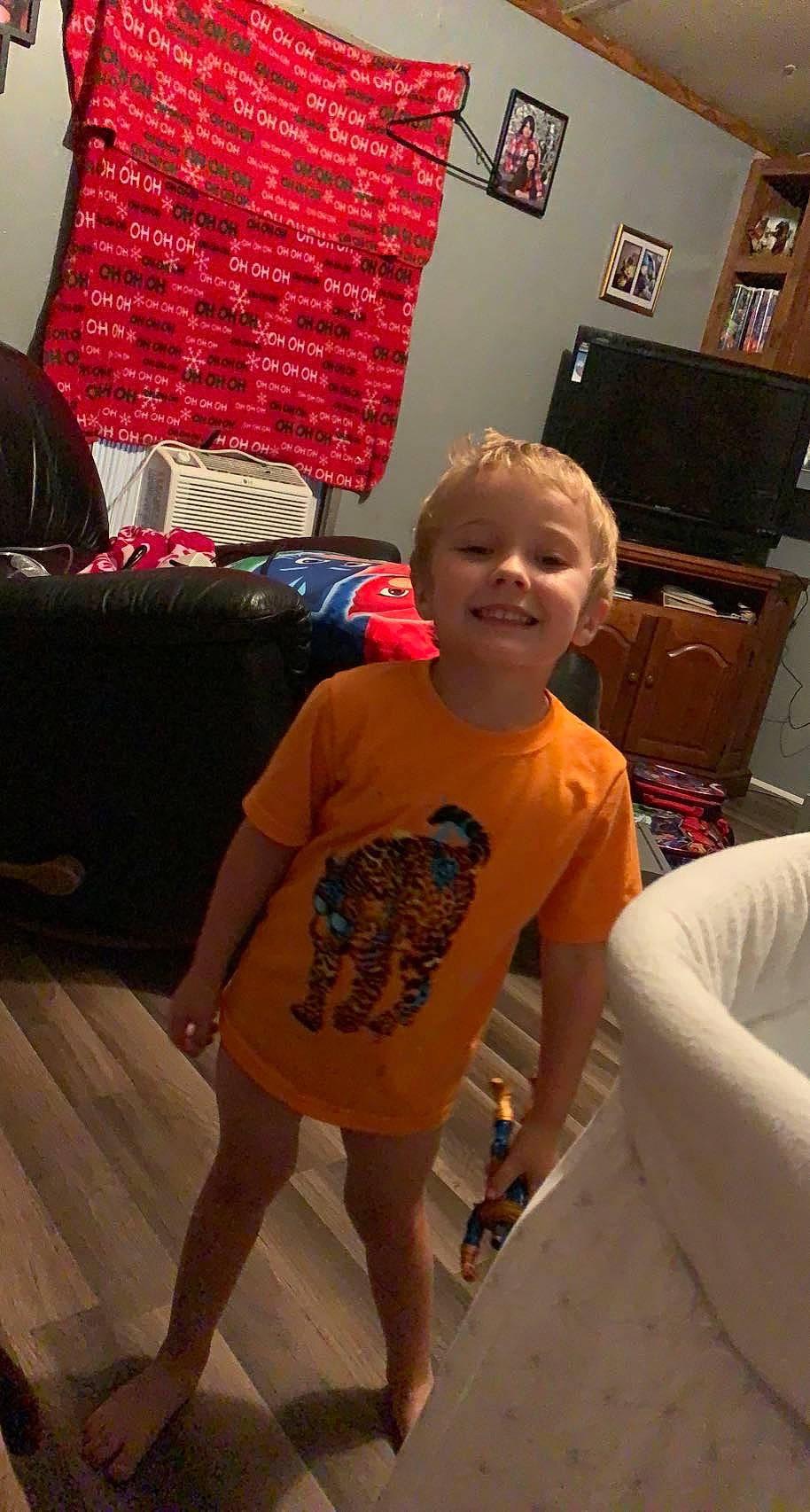 Cody joined the competition — help win amazing prizes! cool, floor, flooring, fun, hairstyle, happy, head, human_body, joint, joy, leg, living_room, person, picture_frame, shorts, shoulder, sleeve, smile, standing, t_shirt