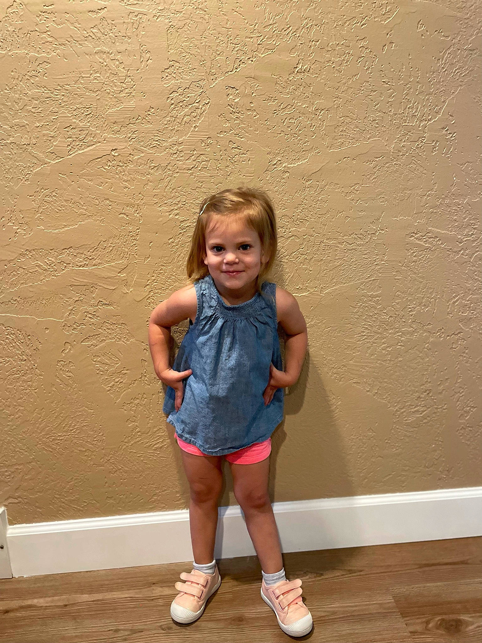 Brynn is registered to the contest to win money with this photo: blond, calf, child, electric_blue, floor, flooring, fun, happy, human_leg, joint, joy, knee, landscape, leisure, person, shorts, sitting, sock, t_shirt, thigh