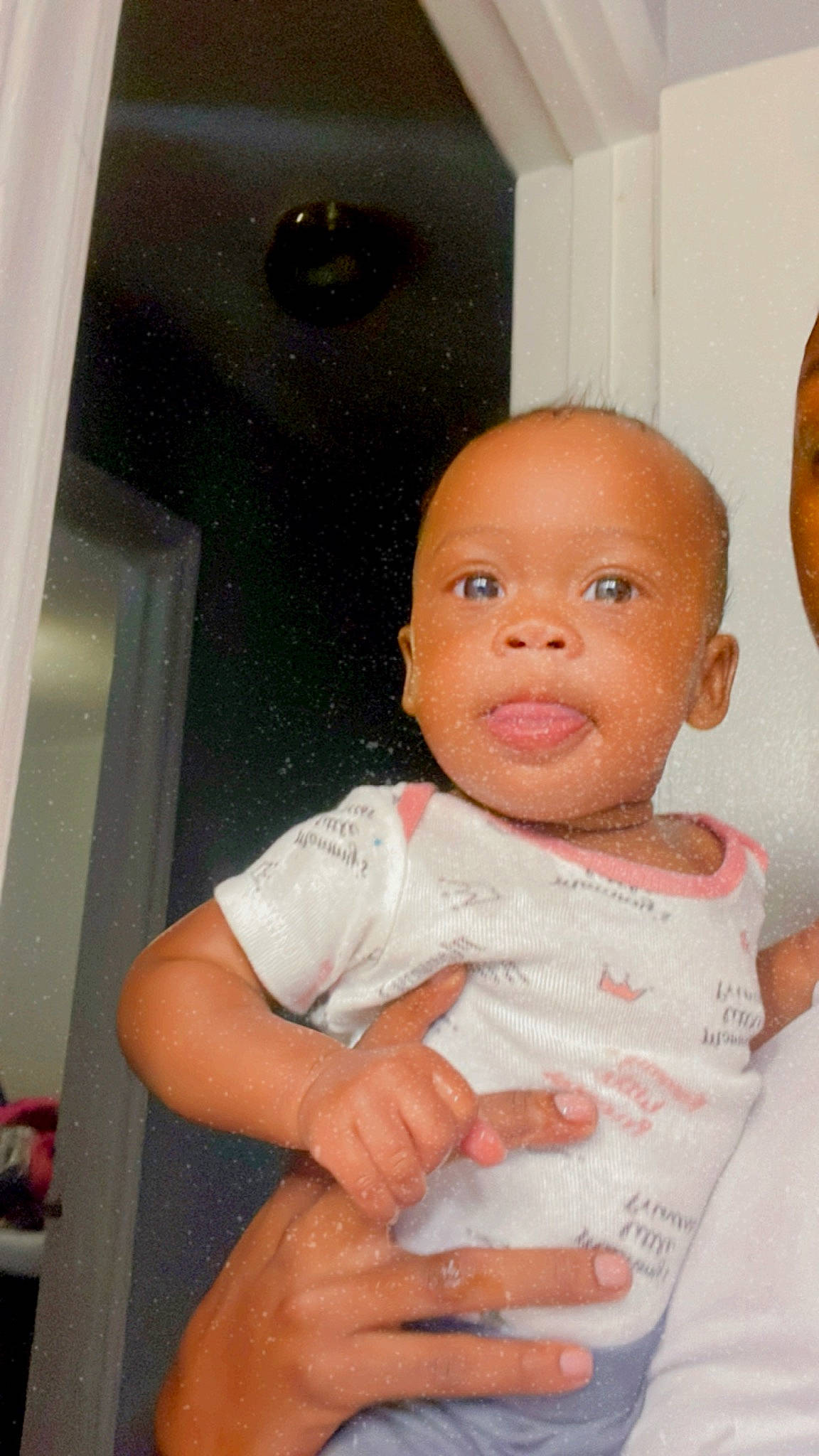 Yani is registered to the contest to win money with this photo: abdomen, baby, baby_toddler_clothing, cheek, chest, child, door, elbow, eyelash, flesh, fun, gesture, happy, nail, nose, person, room, sitting, sleeve, thumb