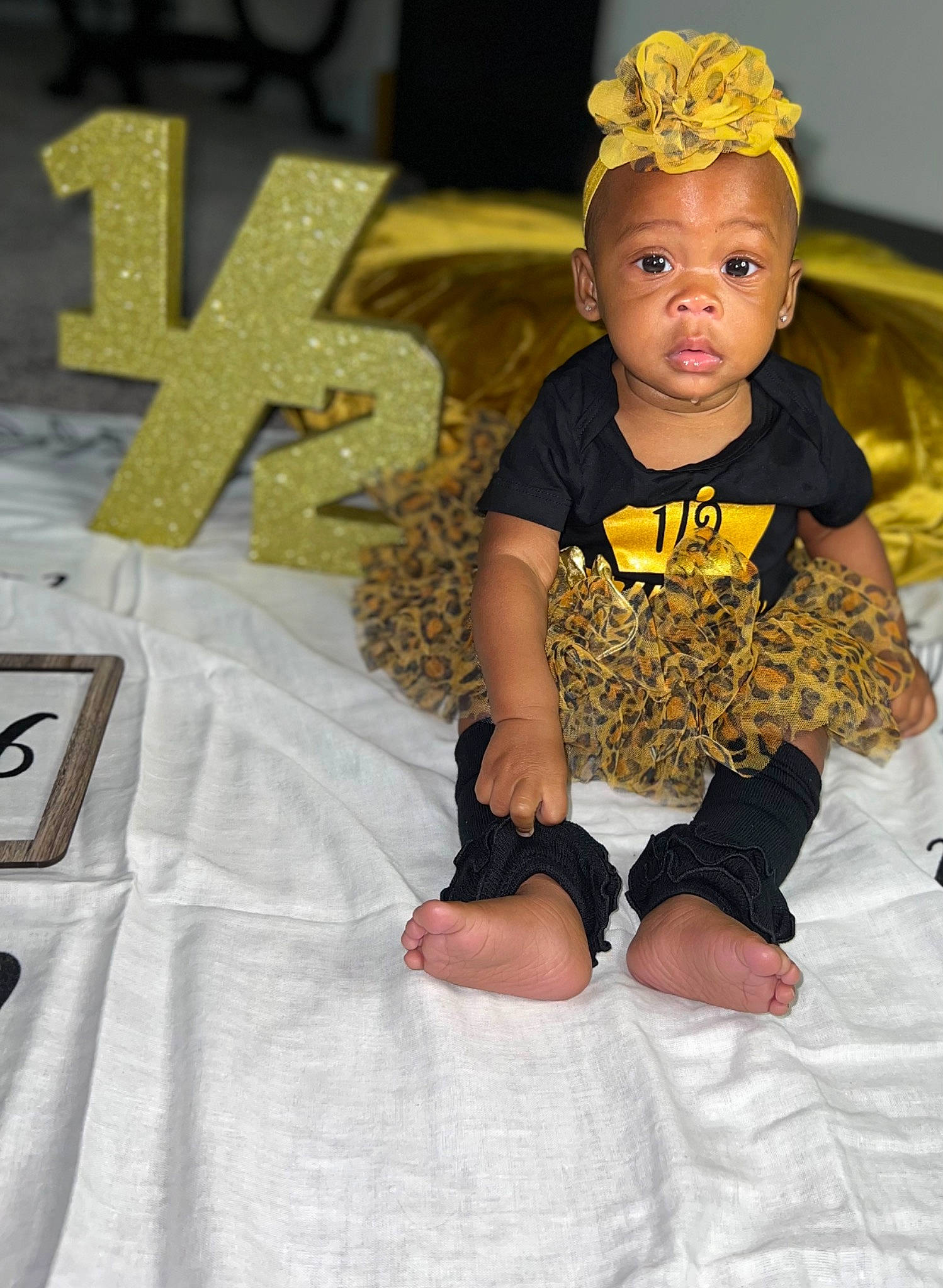 Kayani is registered to the contest to win money with this photo: baby, baby_toddler_clothing, child, costume, costume_hat, crown, design, event, fashion_accessory, fashion_design, fun, hair_accessory, happy, headband, headgear, headpiece, jewellery, person, sleeve, t_shirt