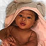 baby, babylaughing, blanket, bonnet, clothing, face, happy, hat, head, newborn, person, photography, portrait, smile, towel