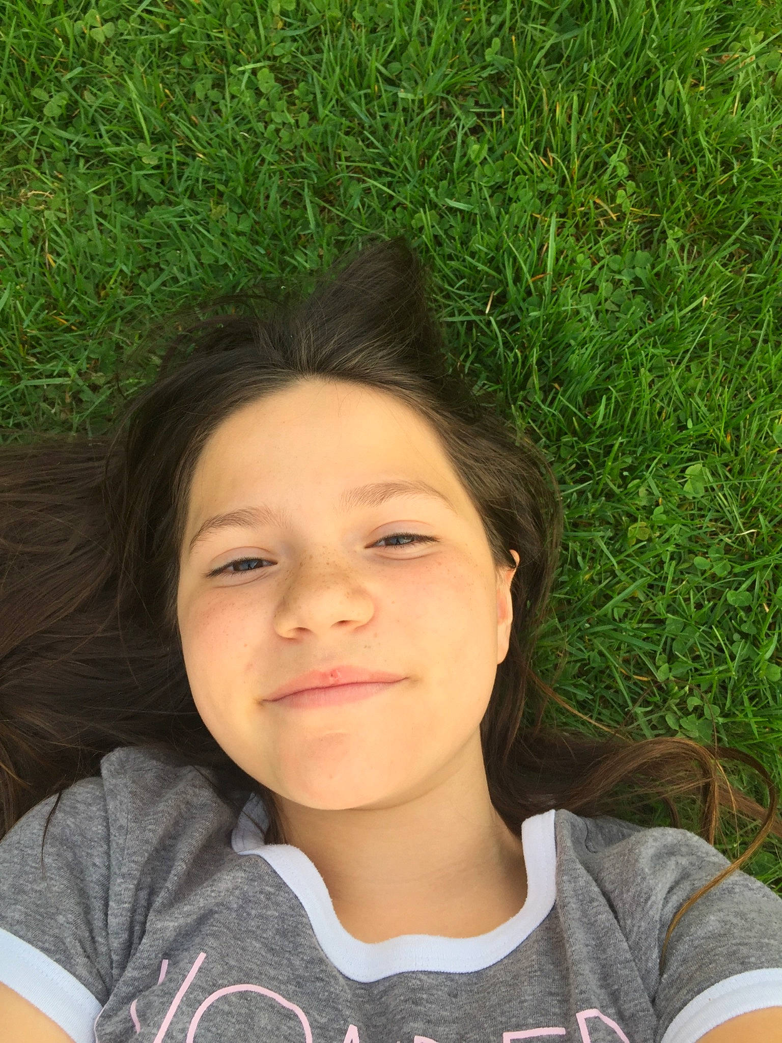 Alessandra is registered to the contest to win money with this photo: black_hair, cheek, child, chin, eyebrow, face, forehead, grass, green, hair, hairstyle, happy, head, lip, long_hair, nose, person, photography, selfie, skin
