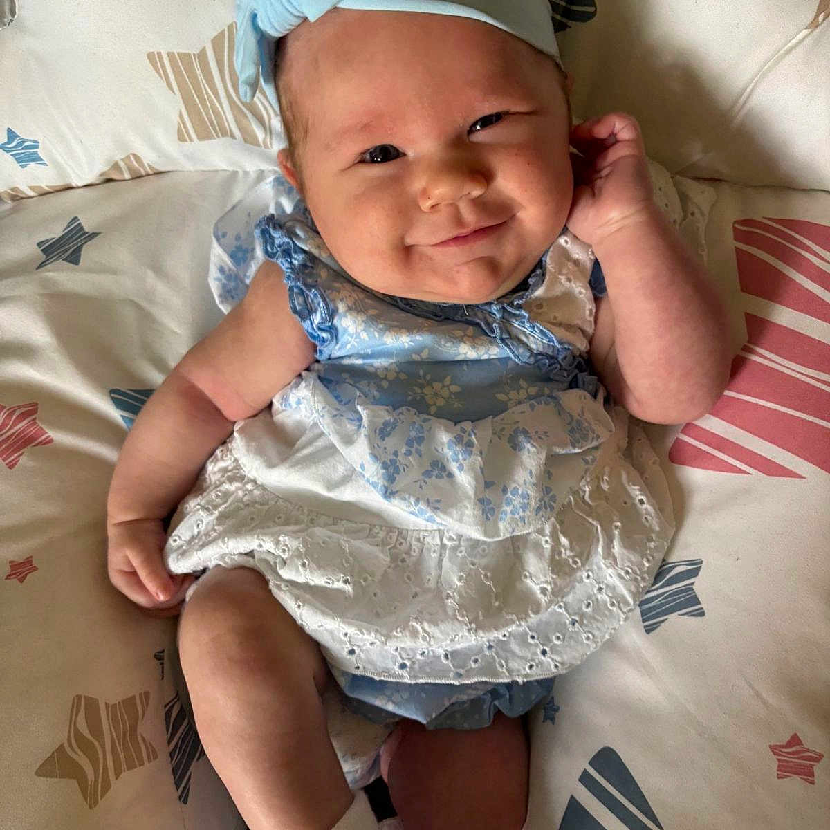 Emma joined the competition — help win amazing prizes! baby, bed, bedroom, clothing, couch, cushion, face, furniture, happy, hat, head, homedecor, indoors, newborn, person, photography, portrait, room, sitting, smile