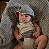 Ryland is registered to the contest to win money with this photo: baby, infant, child, hoodie, shark_hood, gray, chair, blanket, cute, smile, indoor, floor, wooden_floor, furniture, playful, seated, clothing, human, portrait, cozy