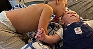 Ryland is registered to the contest to win money with this photo: affection, baby, bed, blanket, candid, child, clothing, cute, family, happy, head, indoor, infant, kiss, love, person, portrait, skin, toddler, young