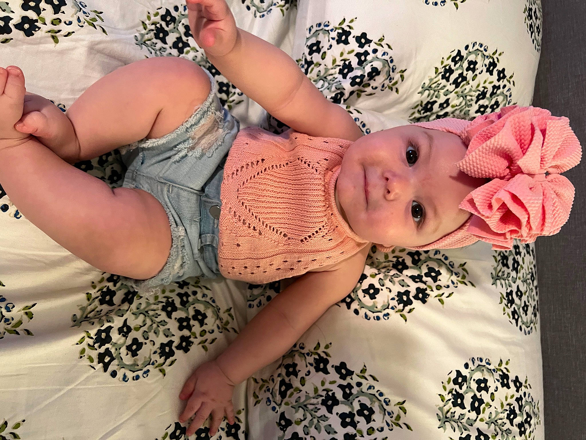 Fallon is registered to the contest to win money with this photo: arm, baby, baby_toddler_clothing, chest, dress, eye, eyelash, finger, glasses, hand, happy, headwear, human_body, leg, mouth, neck, person, skin, sleeve, textile