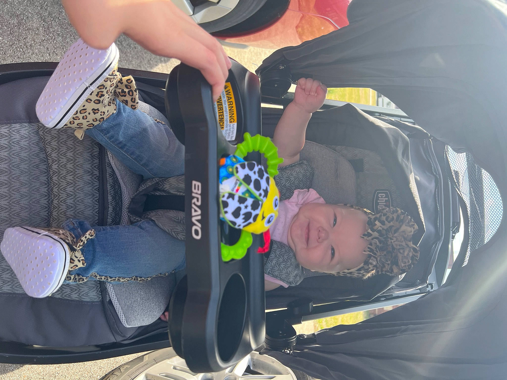 Fallon is registered to the contest to win money with this photo: auto_part, automotive_design, bag, car_seat, fun, gesture, hand, headwear, human_leg, knee, leg, leisure, luggage_and_bags, motor_vehicle, person, recreation, shoe, sneakers, thigh, vehicle_door