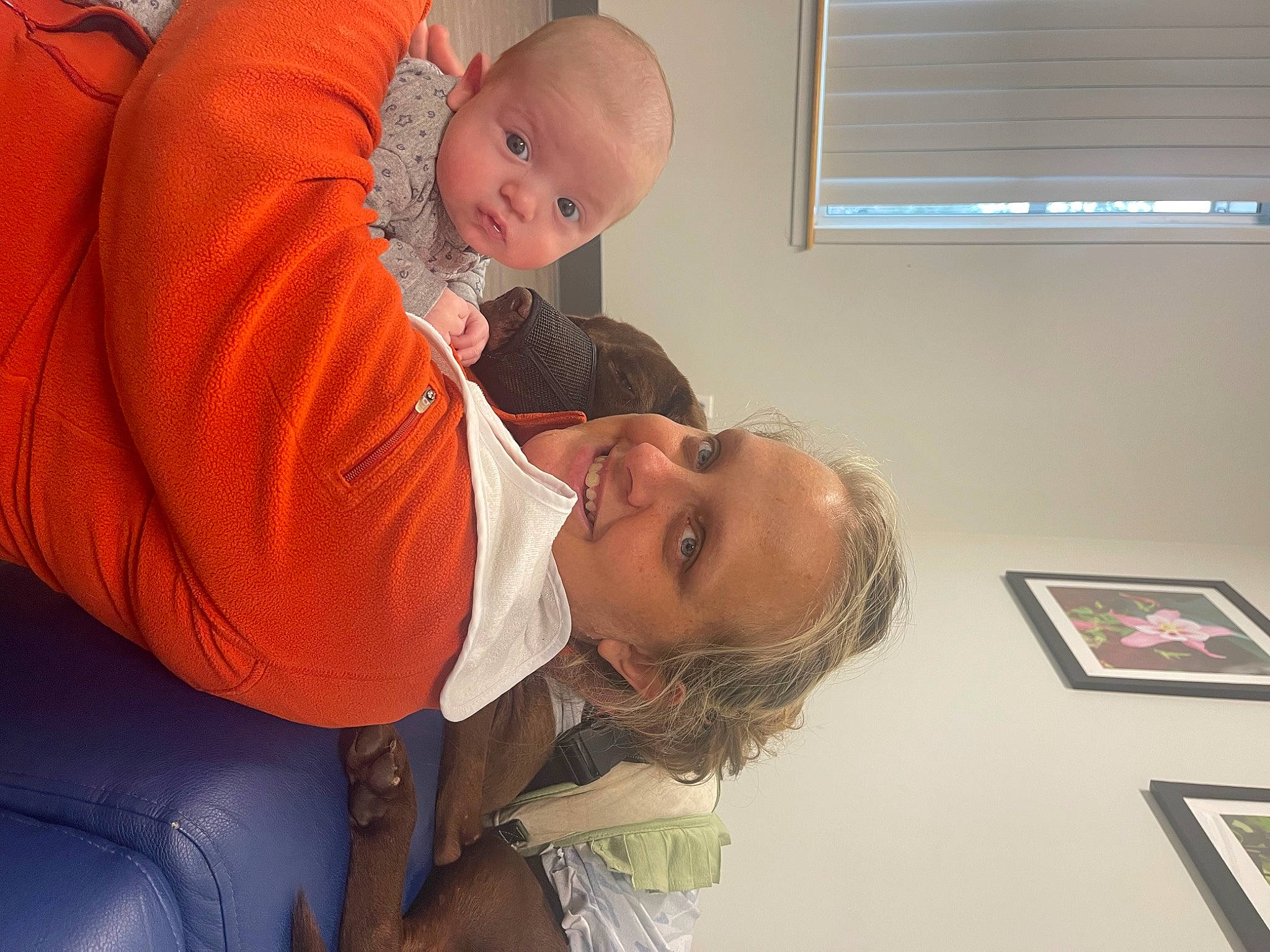Lawrence is registered to the contest to win money with this photo: abdomen, arm, baby, child, comfort, elbow, event, fun, gesture, happy, joint, joy, mouth, person, picture_frame, room, shoulder, sitting, smile, t_shirt