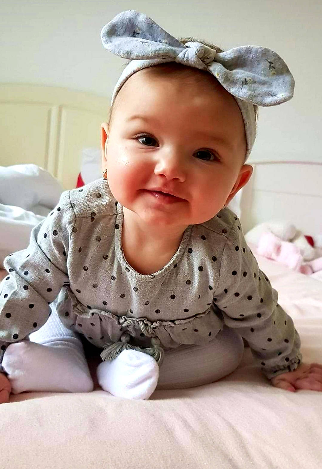 Aylin is registered to the contest to win money with this photo: baby, baby_toddler_clothing, child, hair_accessory, headgear, person, play, skin, smile, toddler