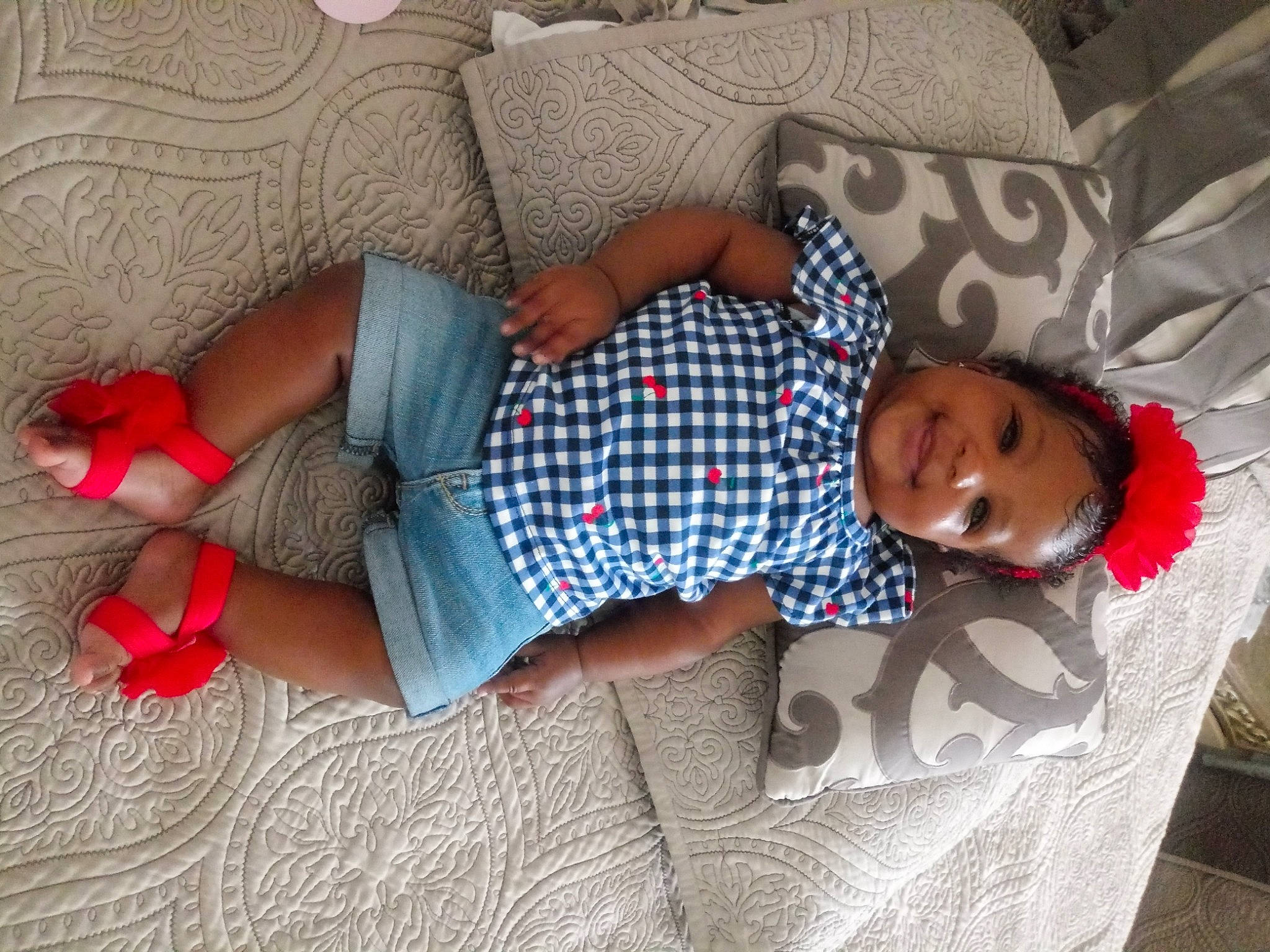 Yah'Dasia is registered to the contest to win money with this photo: baby, baby_toddler_clothing, bedding, child, comfort, finger, floor, flooring, fun, human_leg, joint, joy, knee, linens, pattern, person, room, smile, sock, thigh