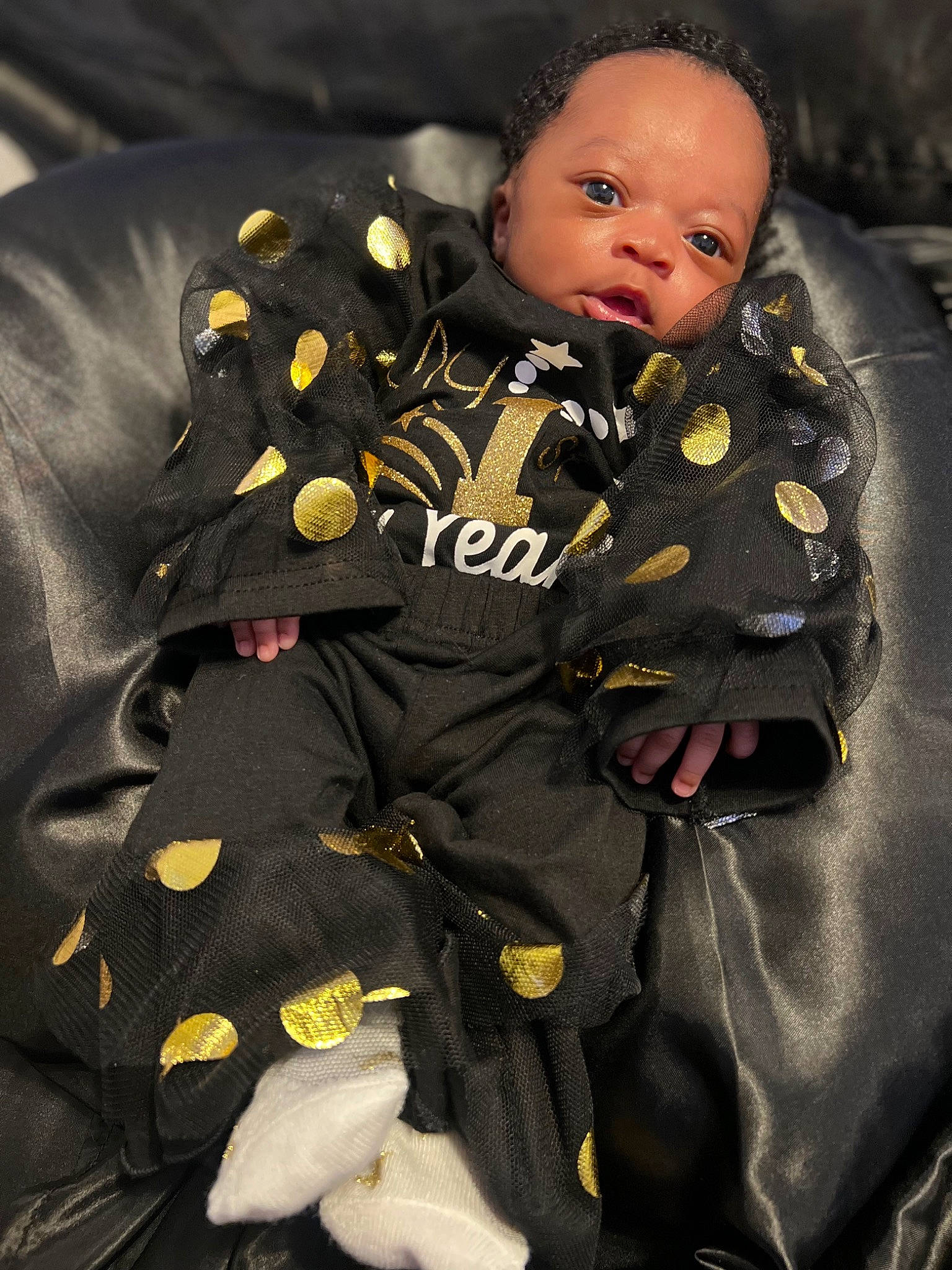 A'Mora joined the competition — help win amazing prizes! baby, baby_products, baby_toddler_clothing, cheek, child, comfort, face, formal_wear, gesture, head, linens, military_camouflage, military_uniform, person, sitting, sleeve, suit, toddler, uniform