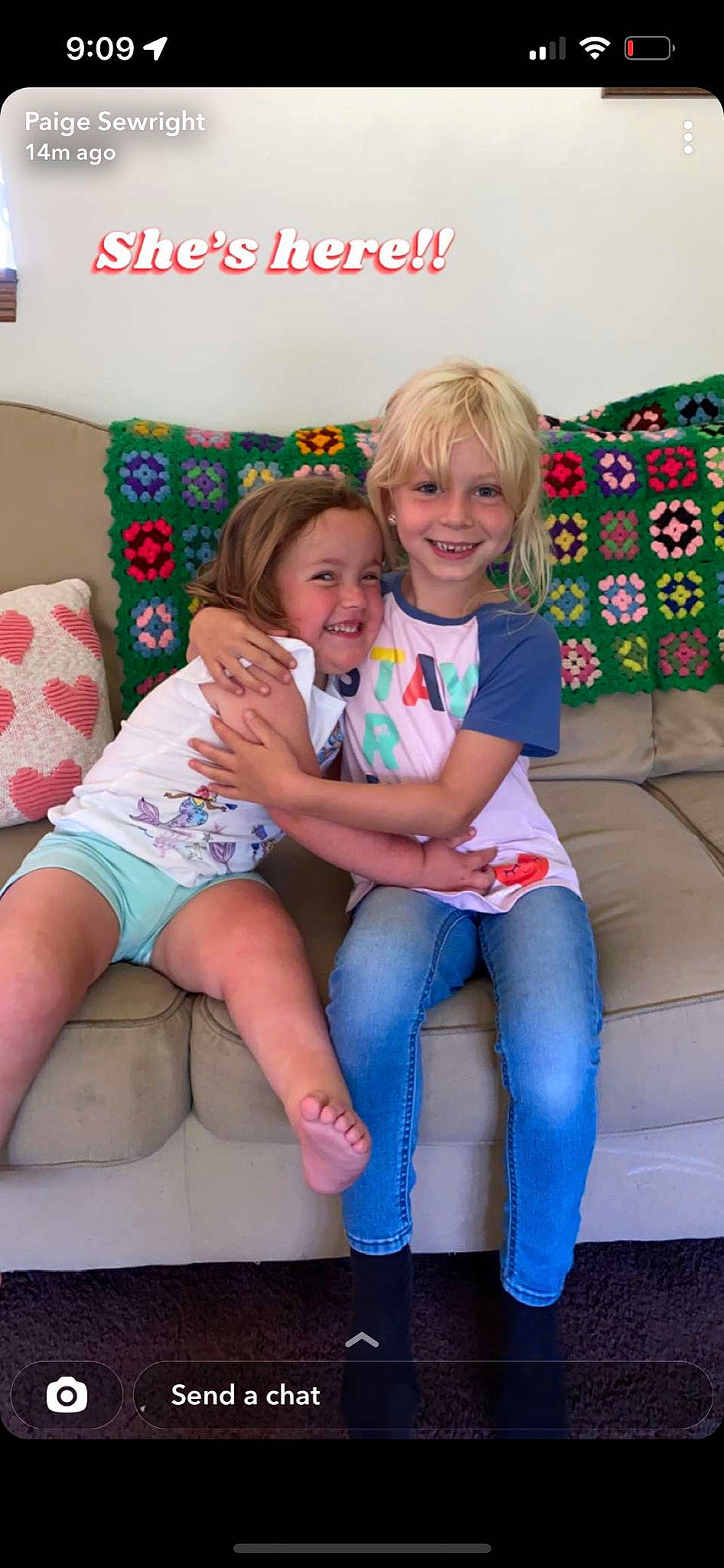 Kimber is registered to the contest to win money with this photo: child, clothing, comfort, couch, face, fun, happy, head, human_body, joy, knee, lap, leg, person, pink, shorts, skin, smile, t_shirt, textile