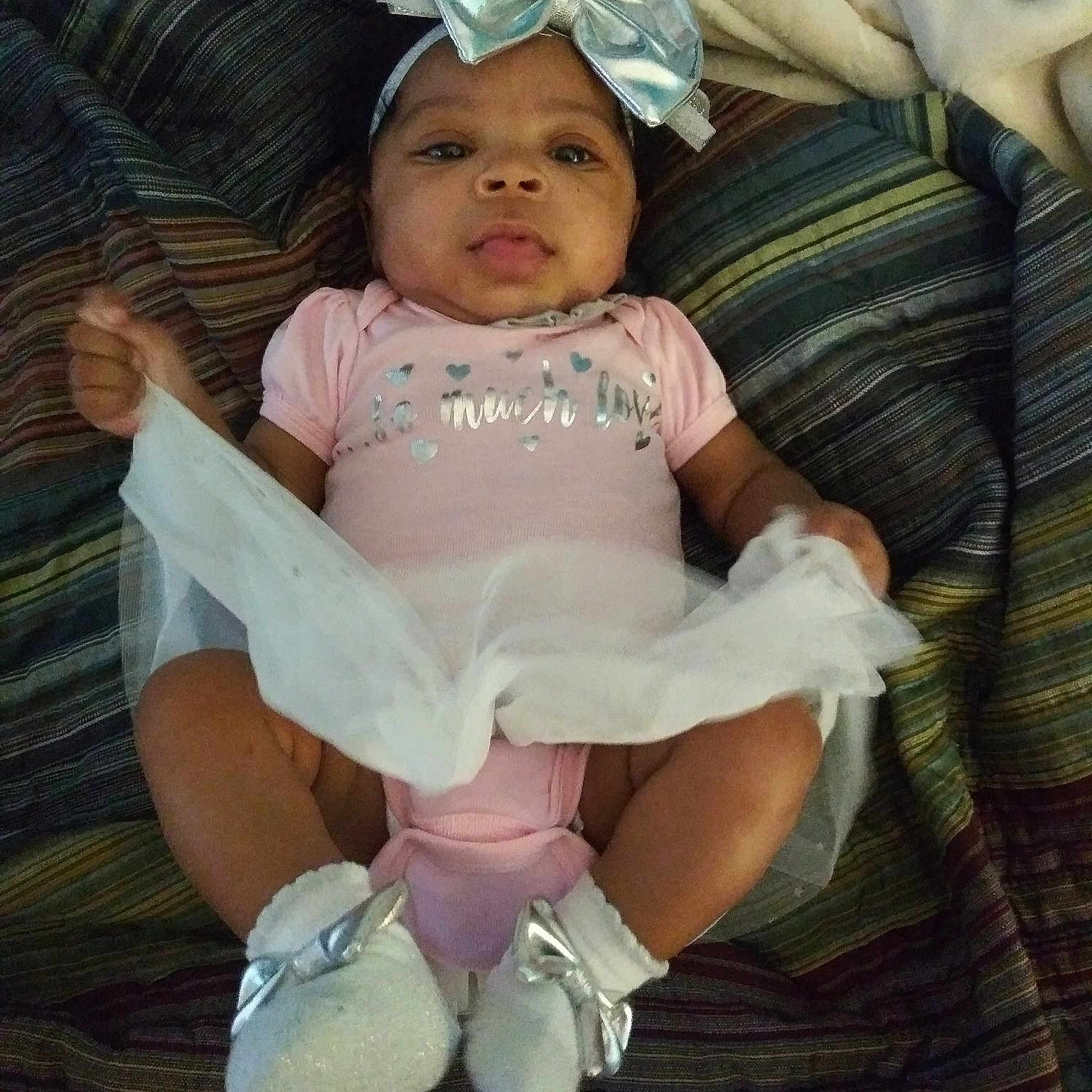 Aamira is registered to the contest to win money with this photo: abdomen, baby, baby_products, baby_toddler_clothing, cheek, child, eye, fun, hand, happy, iris, person, pink, product, sitting, skin, smile, toddler, trunk