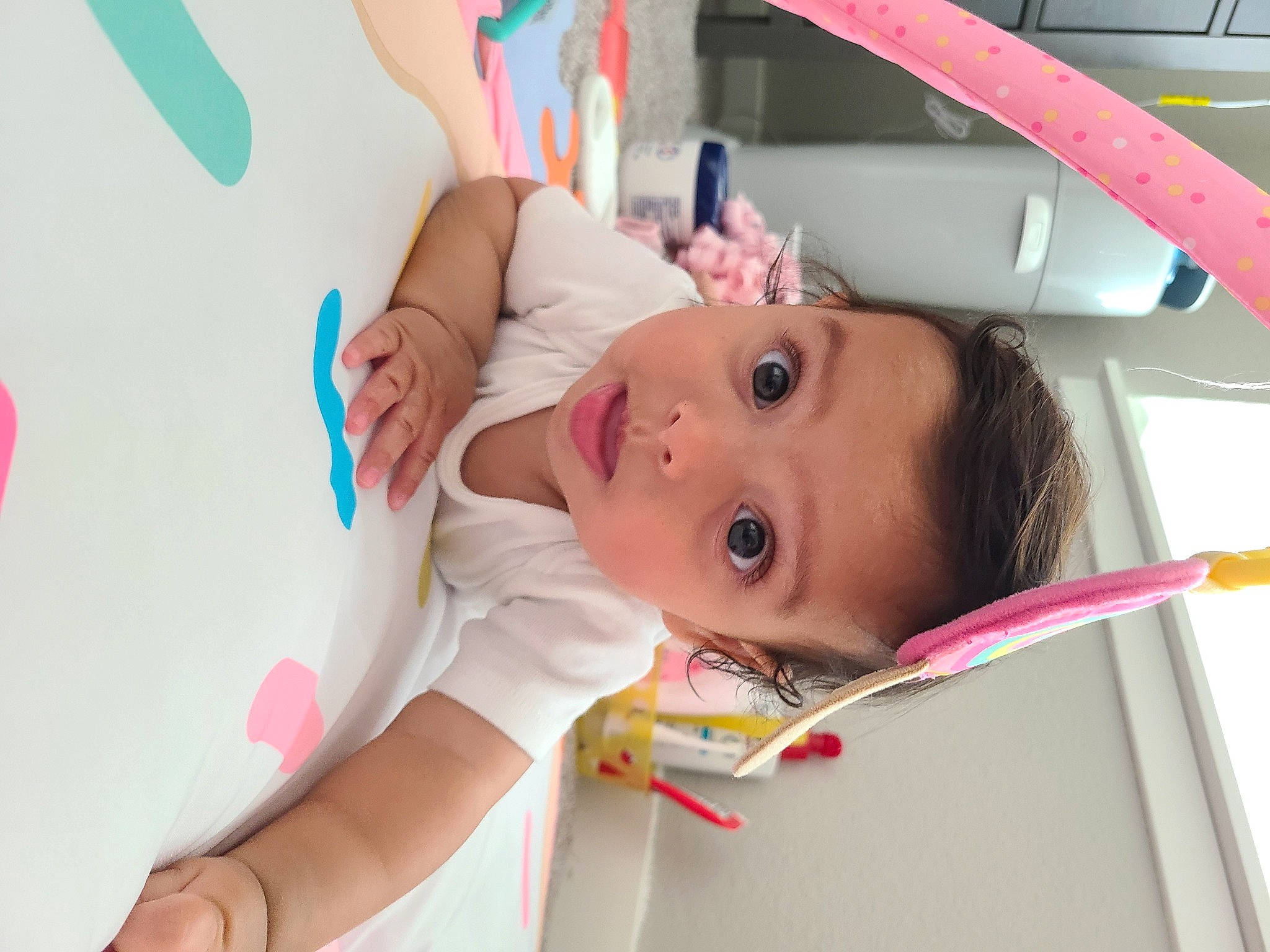 Nayla is registered to the contest to win money with this photo: baby, baby_products, baby_safety, baby_toddler_clothing, cheek, child, comfort, ear, eyebrow, eyelash, fun, happy, mouth, nose, person, pink, room, skin, textile, toddler