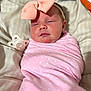 baby, infant, swaddle, pink, bow, headband, pacifier, sleepy, cute, polka_dot, blanket, bed, resting, newborn, face, human, child, soft, comfort, indoors