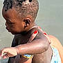 Malick a rejoint le concours — aidez-le/la à gagner de superbes lots ! arm, baby, braided_hair, care, child, diaper, fun, hand, holding, nail_polish, outdoor, person, play, skin, summer, sunlight, support, swimming, toddler, water