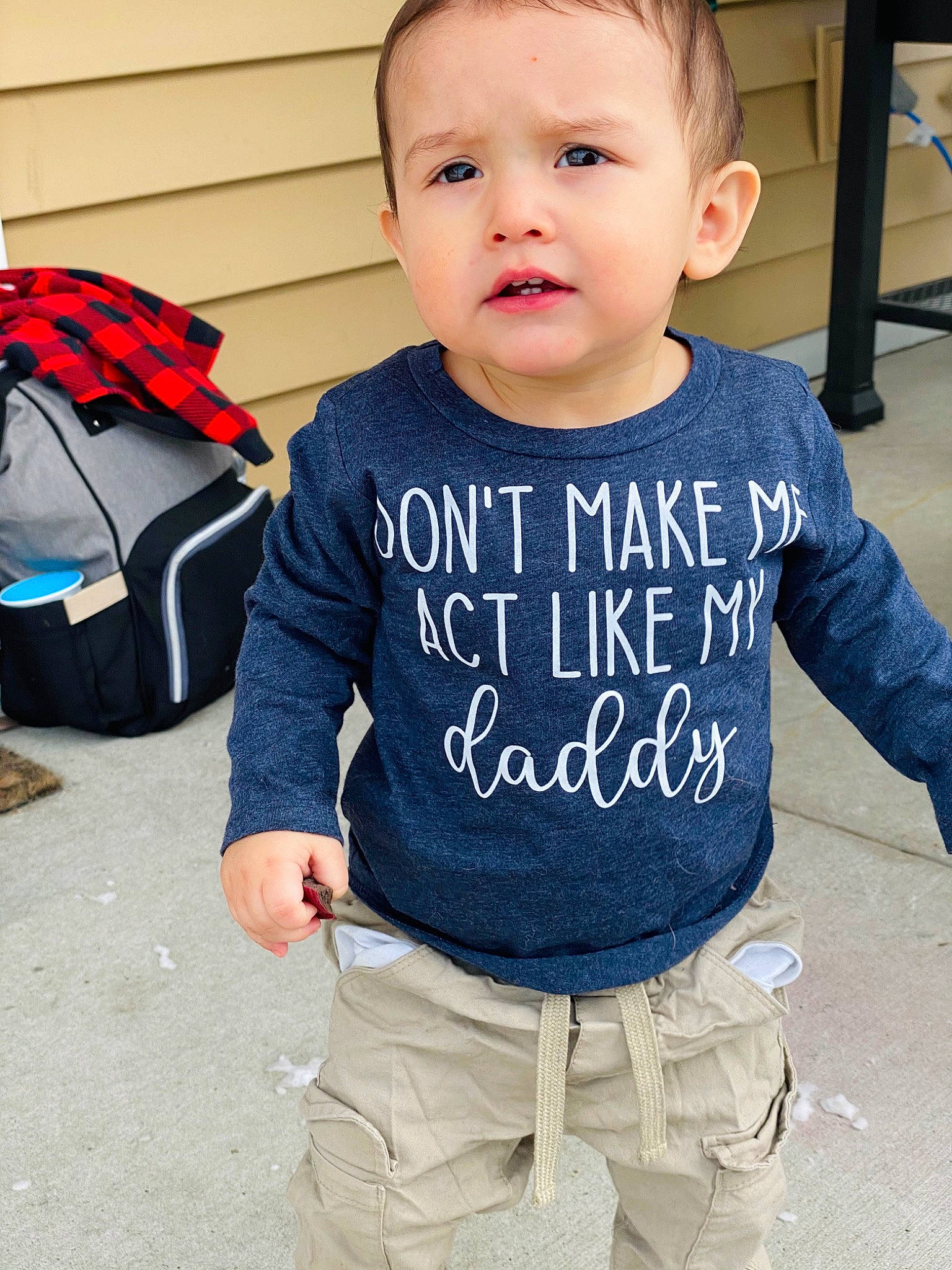 Frank is registered to the contest to win money with this photo: baby_toddler_clothing, bag, child, cool, electric_blue, face, hairstyle, happy, head, human, joint, luggage_and_bags, person, photograph, product, shoulder, sleeve, sorrow, standing, street_fashion