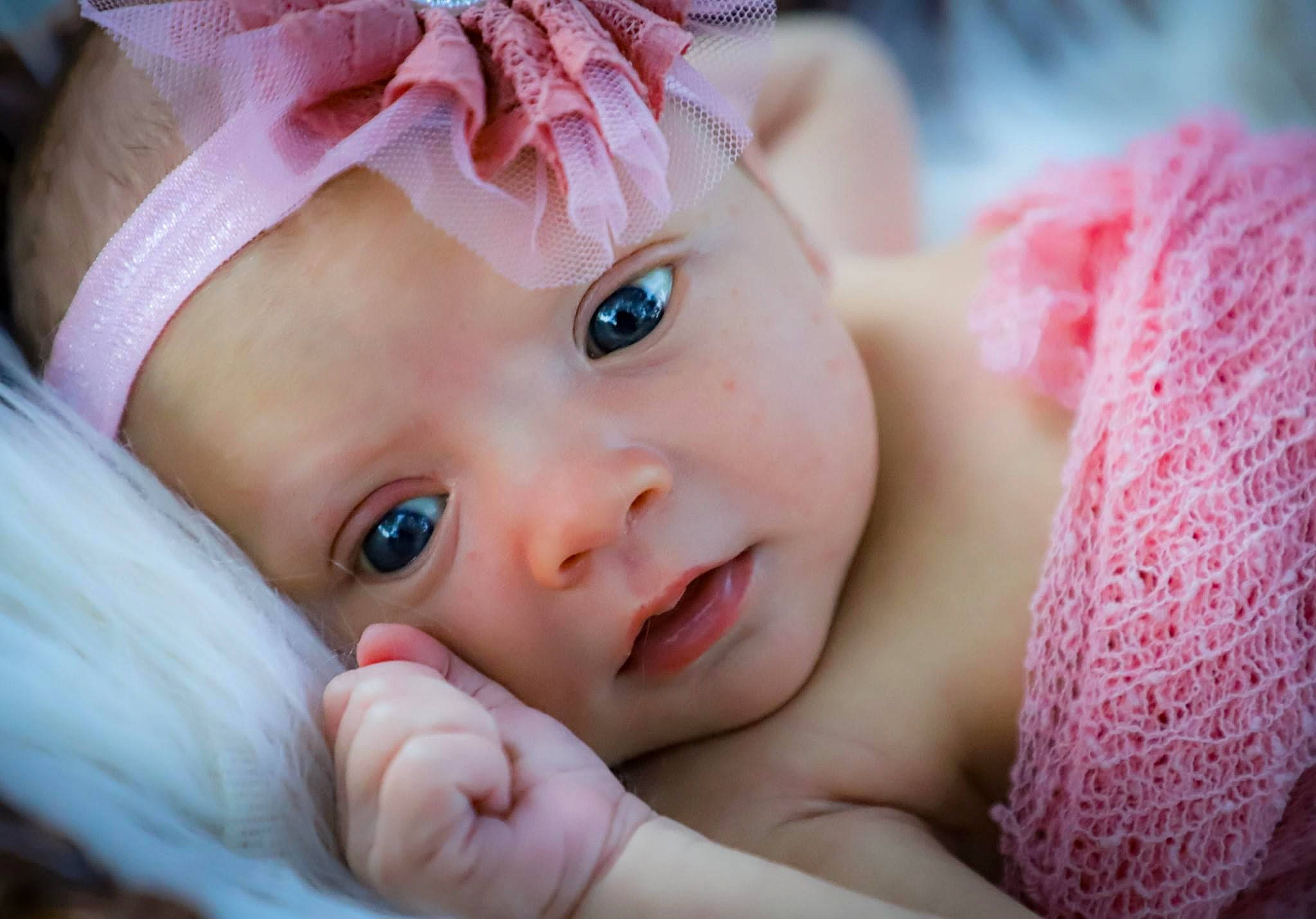 Anna-leigh is registered to the contest to win money with this photo: baby, beauty, cheek, child, close_up, eye, eyelash, face, hair_accessory, hand, head, headgear, iris, lip, nose, person, photography, pink, portrait_photography, skin
