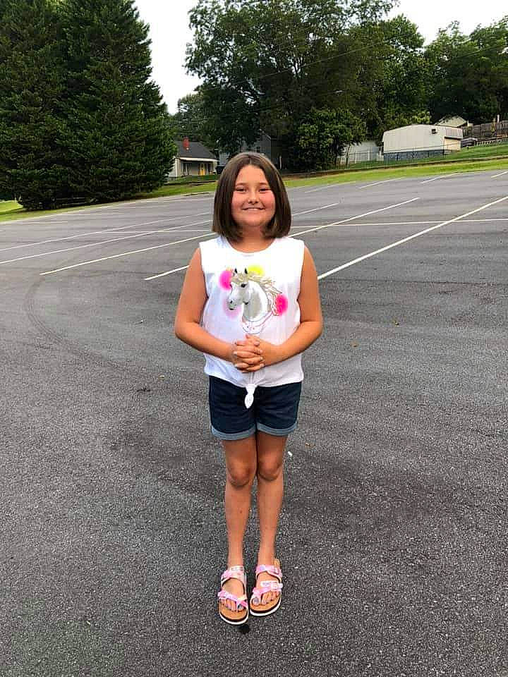 Aubrey joined the competition — help win amazing prizes! asphalt, electric_blue, grass, human_body, joy, knee, leg, leisure, person, plant, recreation, road, road_surface, shorts, sky, sleeve, smile, sportswear, t_shirt, thigh