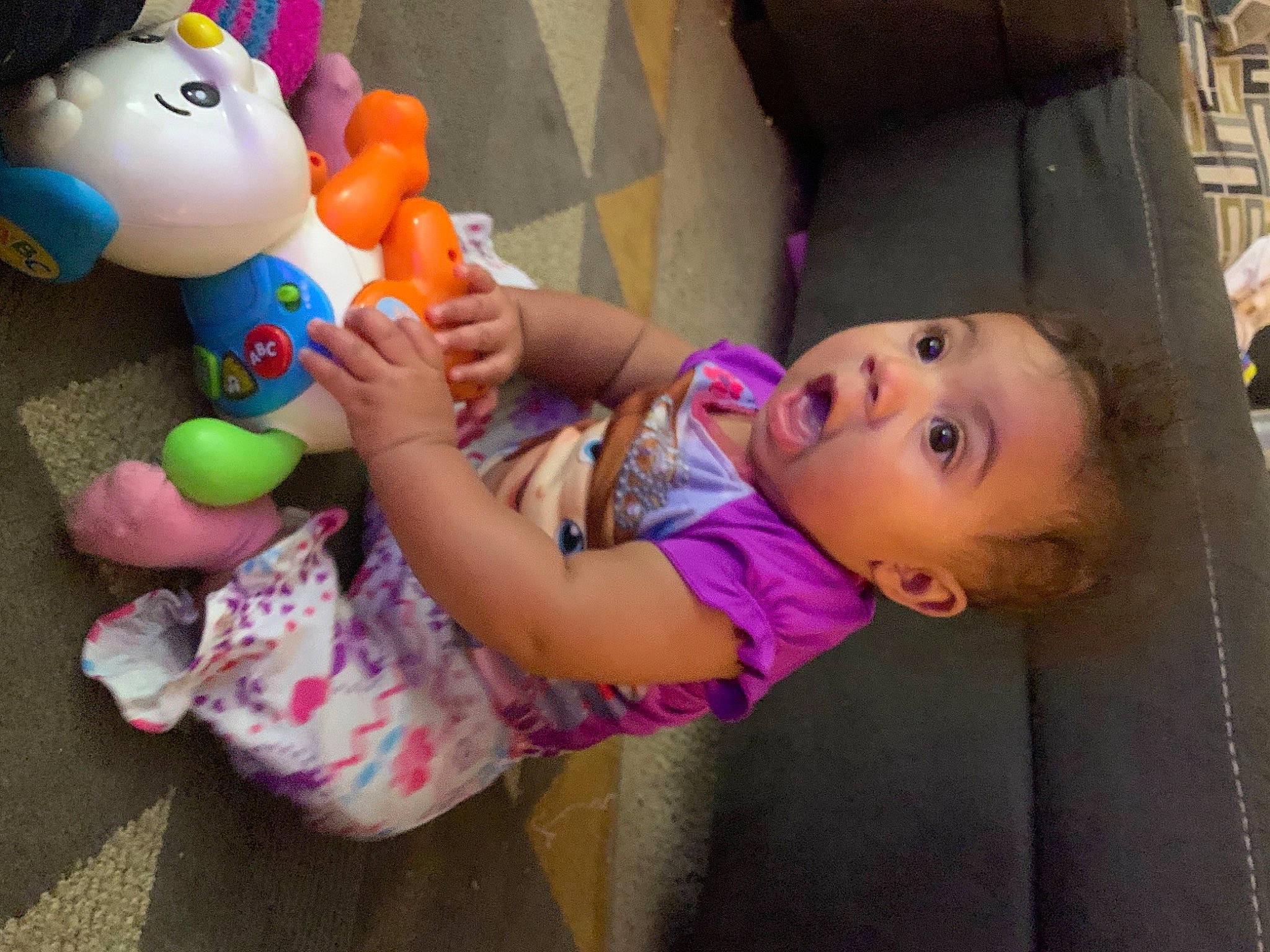 Venus is registered to the contest to win money with this photo: baby, baby_playing_with_toys, baby_products, baby_toddler_clothing, baby_toys, beauty, box, cheek, child, fun, happy, leisure, person, pink, plush, purple, shipping_box, skin, stuffed_toy, surprise