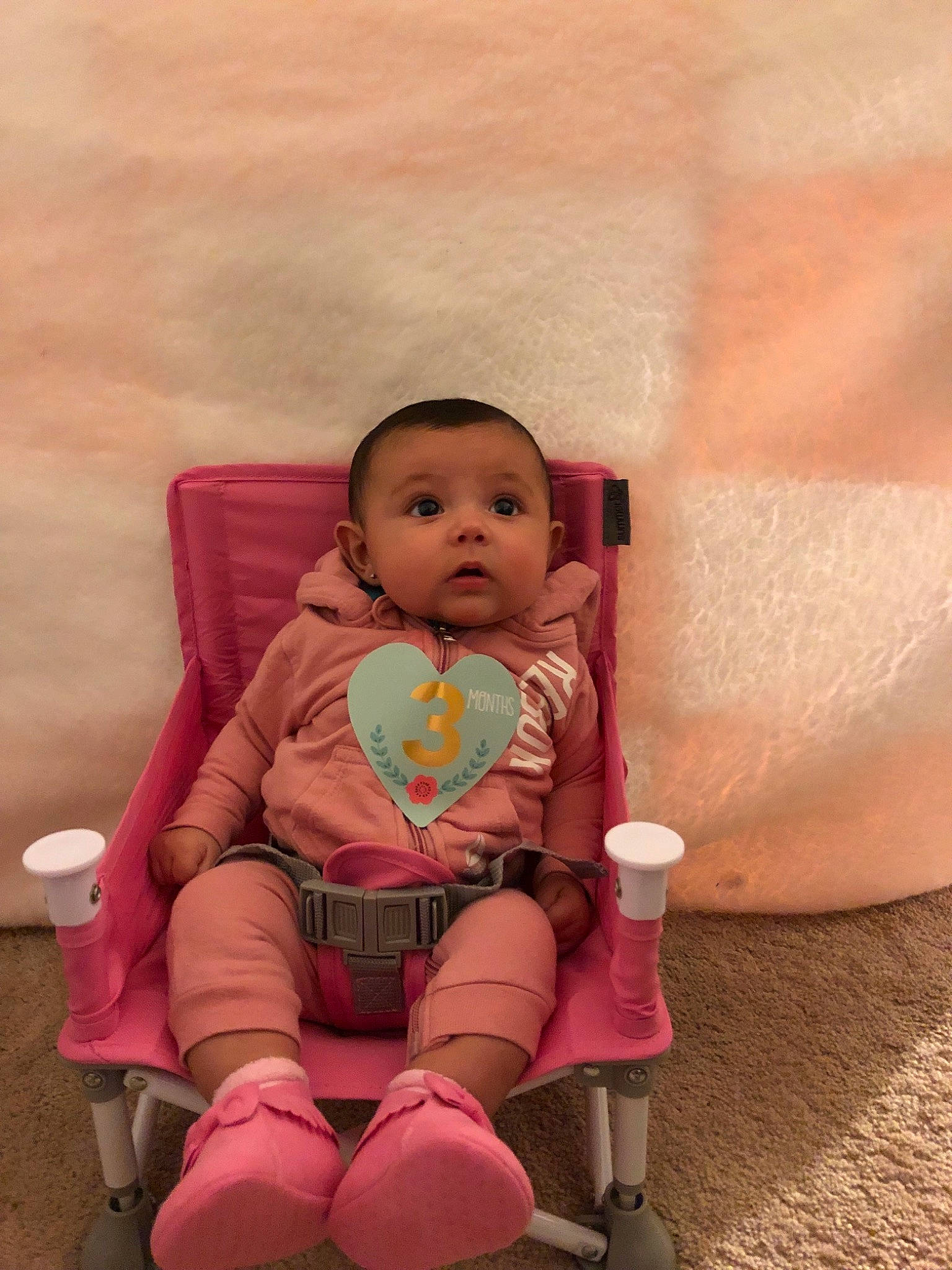 Amiah is registered to the contest to win money with this photo: child, eye, fun, girl, infant, person, pink, play, product, red, sitting, skin, smile, surprise, toddler, toy