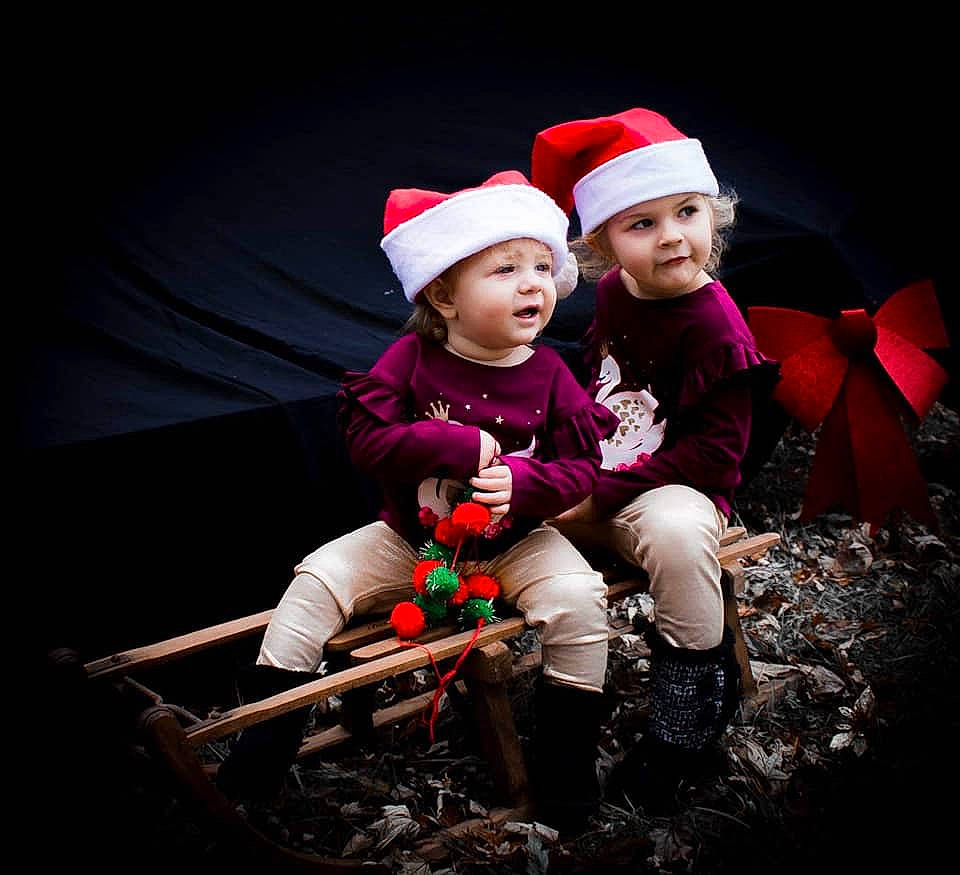 Makenlee is registered to the contest to win money with this photo: child, christmas, christmas_decoration, event, fun, girl, headgear, headwear, holiday, person, red, smile
