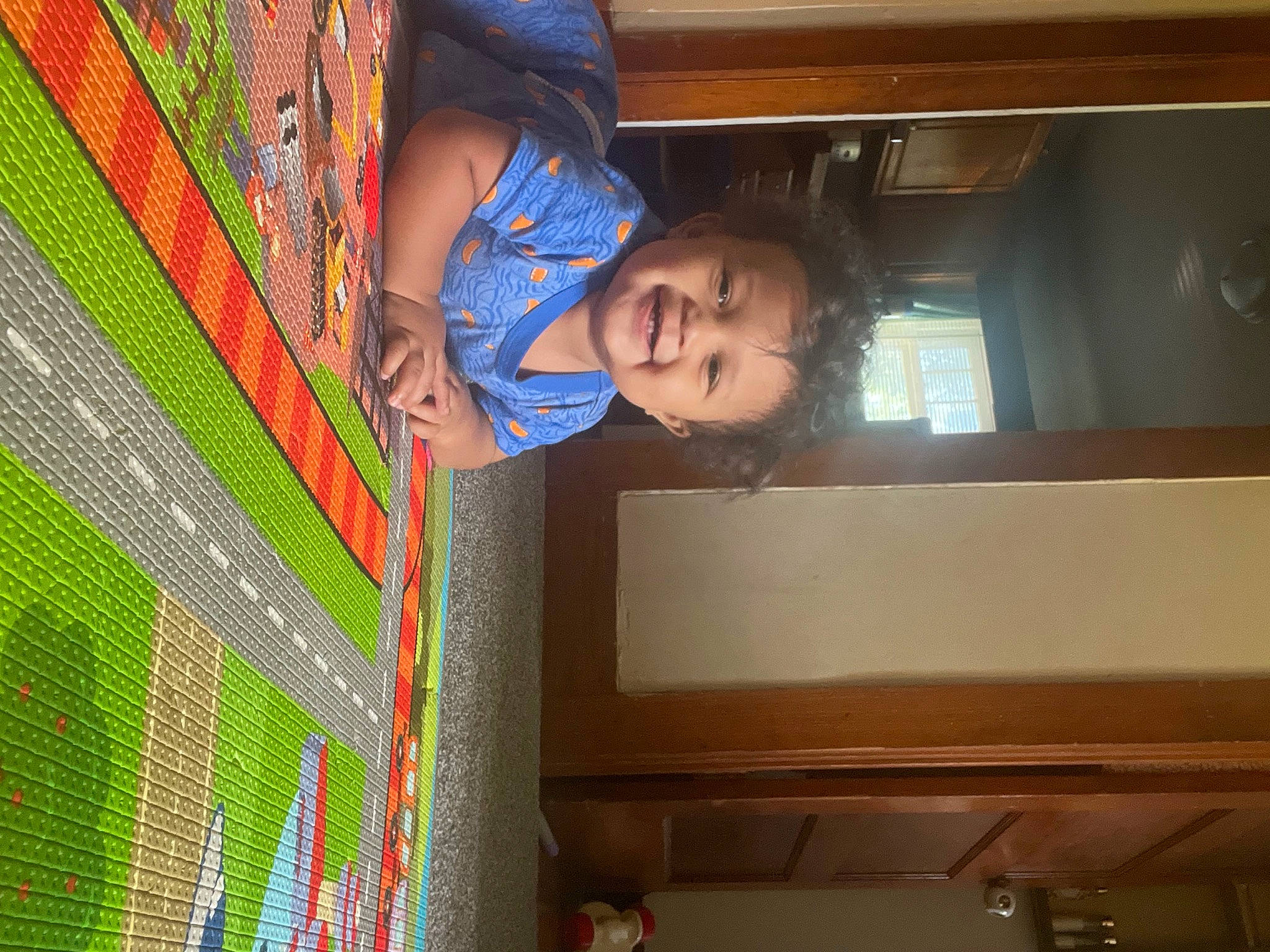 Braylon joined the competition — help win amazing prizes! child, denim, electric_blue, flooring, fun, joy, leisure, linens, magenta, pattern, person, plaid, room, shipping_box, t_shirt, tints_and_shades, toddler, visual_arts, wood