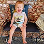 Henry joined the competition — help win amazing prizes! toddler, child, smiling, laughing, bench, cushion, brick_wall, outdoor, shorts, sleeveless_shirt, mickey_mouse, barefoot, happy, person, metal_bench, patterned_rug, pillow, red_hair, cute, summer