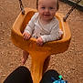 Nova joined the competition — help win amazing prizes! toddler, child, swing, playground, yellow_swing, smiling, happy, outdoor, wood_chips, baby, play, park, fence, person, clothing, hair_tie, legs, bag, colorful, daylight