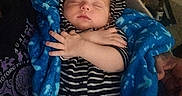 Oryan is registered to the contest to win money with this photo: arms_crossed, baby, blanket, blue, child, cozy, cute, hoodie, indoor, infant, newborn, peaceful, person, portrait, resting, sleeping, soft, striped_clothing, toddler, warm