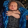 Oryan is registered to the contest to win money with this photo: baby, sleeping, blanket, blue, striped_clothing, hoodie, arms_crossed, infant, indoor, peaceful, cute, child, person, soft, warm, resting, cozy, newborn, portrait, toddler