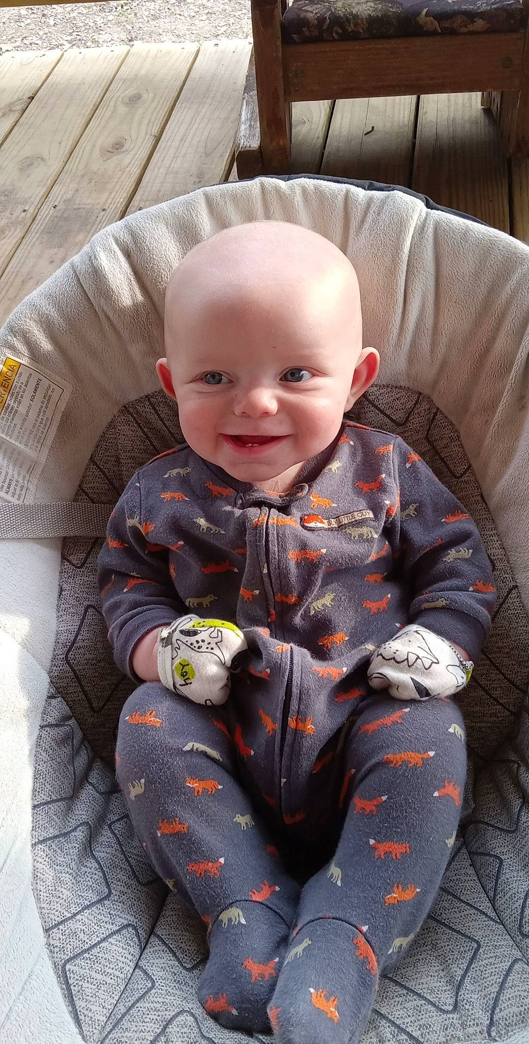 Braylon is registered to the contest to win money with this photo: baby, baby_products, baby_toddler_clothing, carmine, chair, child, comfort, couch, eye, fun, happy, human_body, joy, lap, pattern, person, product, sitting, sleeve, smile