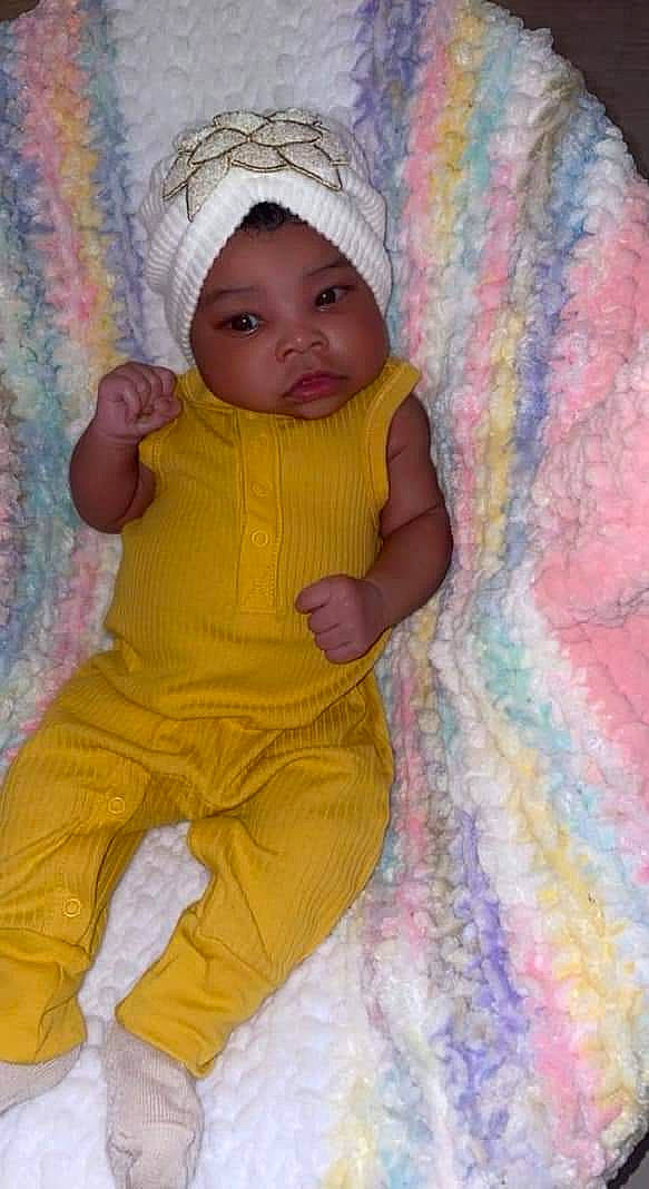 Kiara is registered to the contest to win money with this photo: baby, baby_toddler_clothing, beauty, cheek, child, eye, face, facial_expression, fun, happy, headwear, iris, linens, magenta, person, pink, purple, skin, sleeve, textile