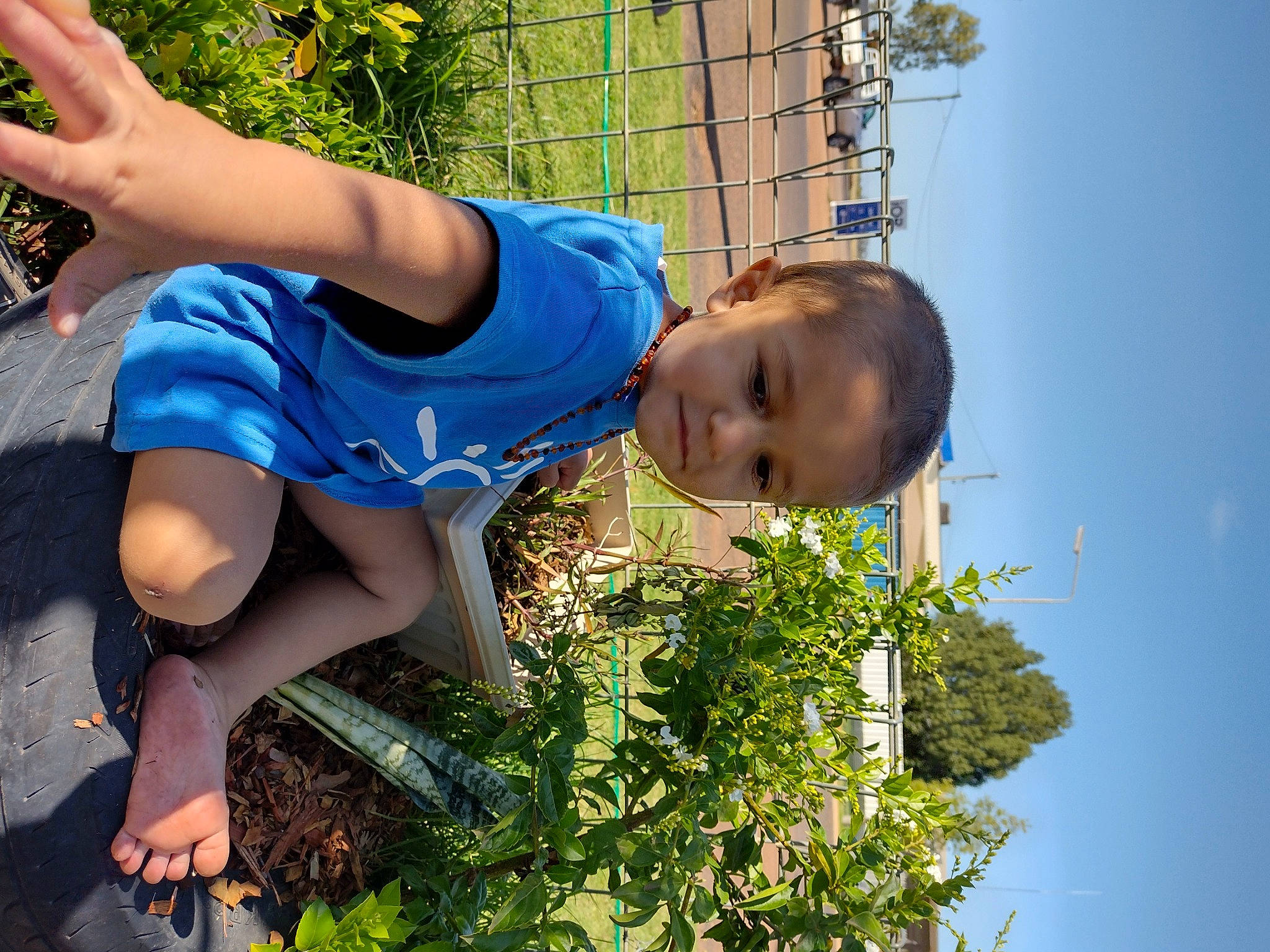 Dhecklin is registered to the contest to win money with this photo: azure, daytime, eye, grass, happy, human_body, knee, leaf, leisure, light, people_in_nature, person, photograph, plant, shorts, sky, thigh, tree, water, white