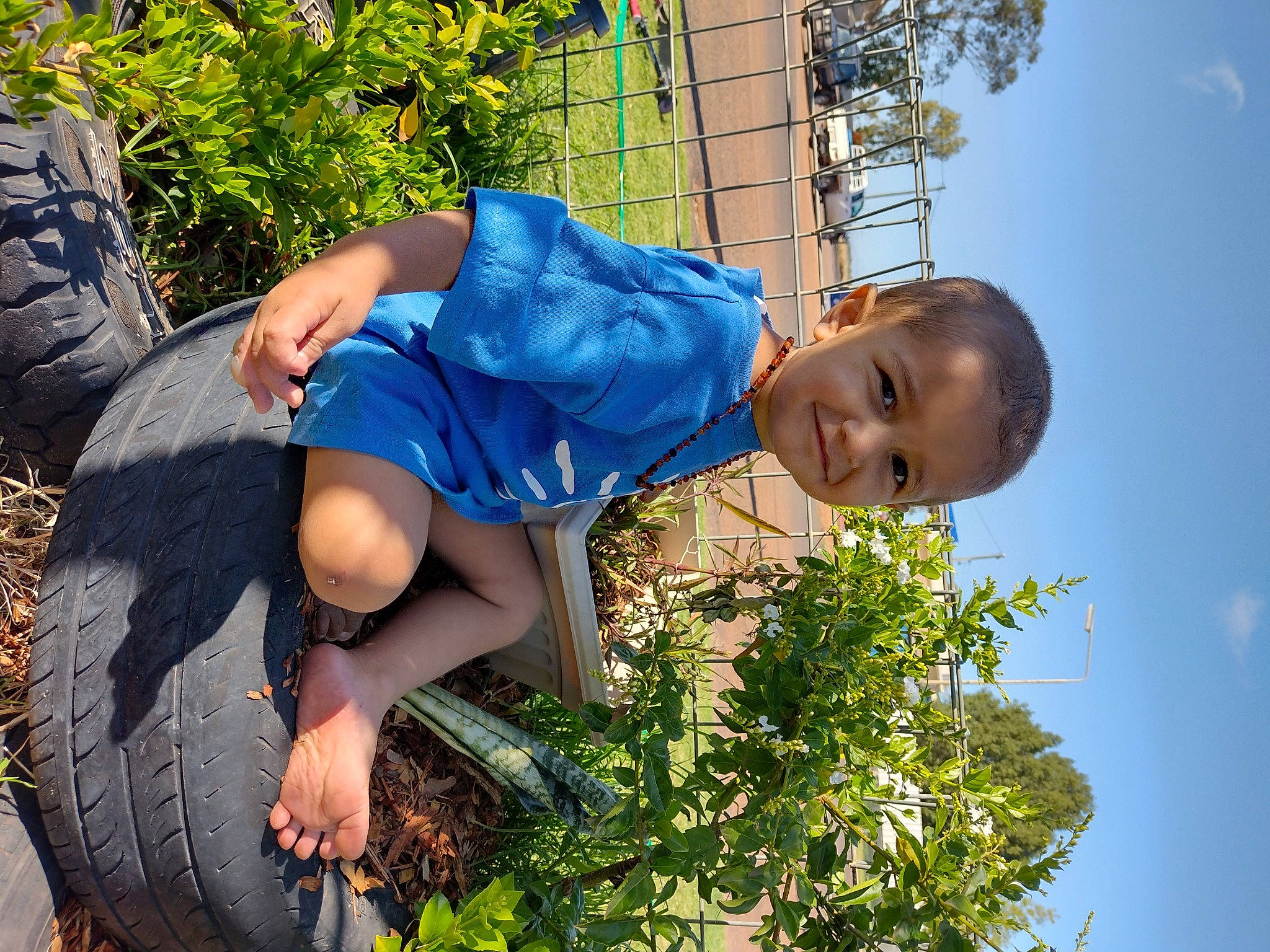 Dhecklin is registered to the contest to win money with this photo: azure, botany, child, daytime, electric_blue, fun, grass, happy, hat, joy, leisure, people_in_nature, person, plant, shorts, sky, summer, sunlight, t_shirt, thigh