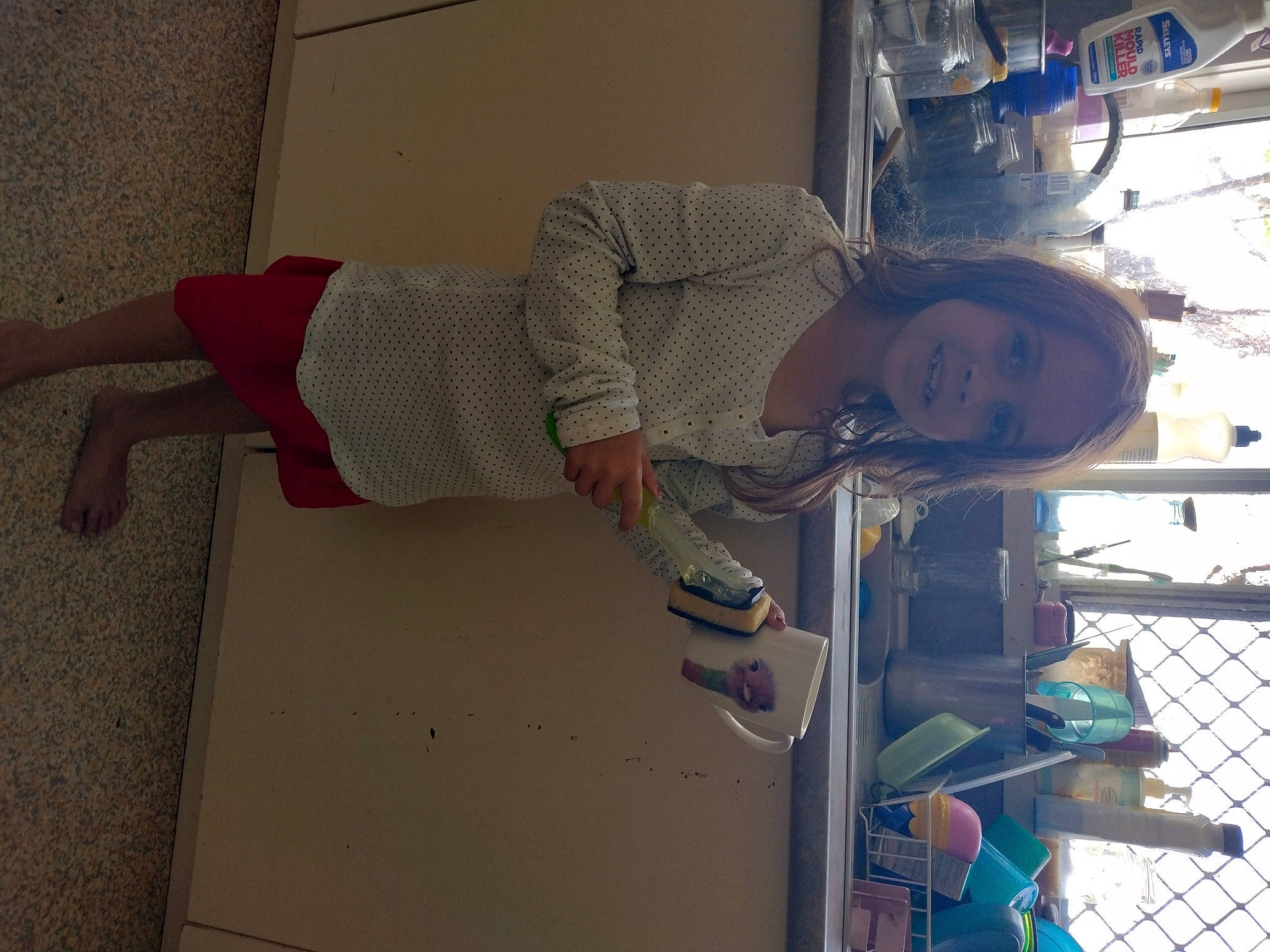 Charley is registered to the contest to win money with this photo: elbow, electric_blue, engineering, flooring, fun, glass, human_leg, knee, machine, person, room, smile, textile, thigh, waist, wood, wrist