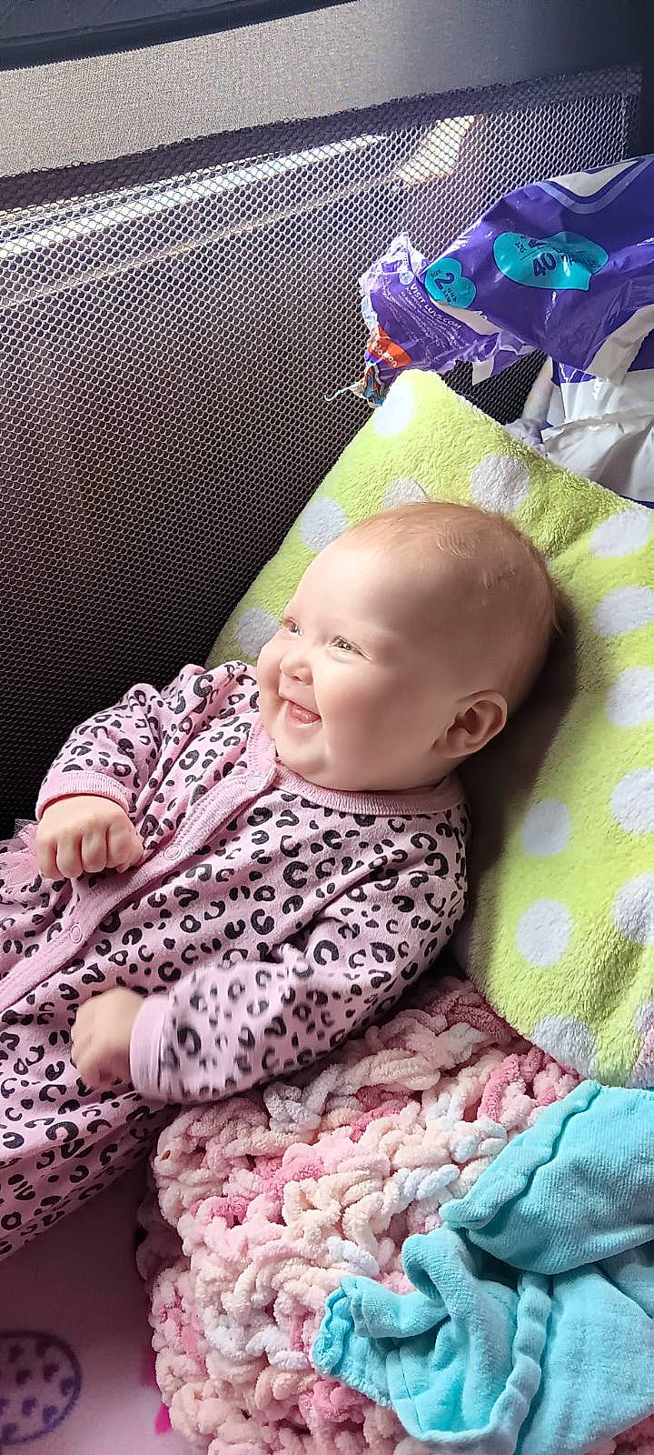 Avery is registered to the contest to win money with this photo: baby, baby_products, baby_toddler_clothing, cheek, child, comfort, fun, grass, happy, linens, magenta, pattern, person, pink, play, purple, sitting, sleeve, smile, textile