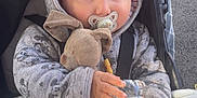 Lucyanno participe au concours pour gagner de l'argent avec cette photo : baby, blanket, bottle, child, clothing, cozy, cute, face, hand, hoodie, mickey_mouse, outside, pacifier, person, plush_toy, shadow, stroller, sunlight, toddler, water
