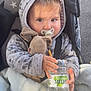baby, blanket, bottle, child, clothing, cozy, cute, face, hand, hoodie, mickey_mouse, outside, pacifier, person, plush_toy, shadow, stroller, sunlight, toddler, water
