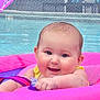 baby, canopy, child, cute, face, float, happy, infant, inflatable_ring, mesh_fence, outdoor, pink, playful, pool, smiling, summer, swimming, water, water_reflection, yellow_clothing