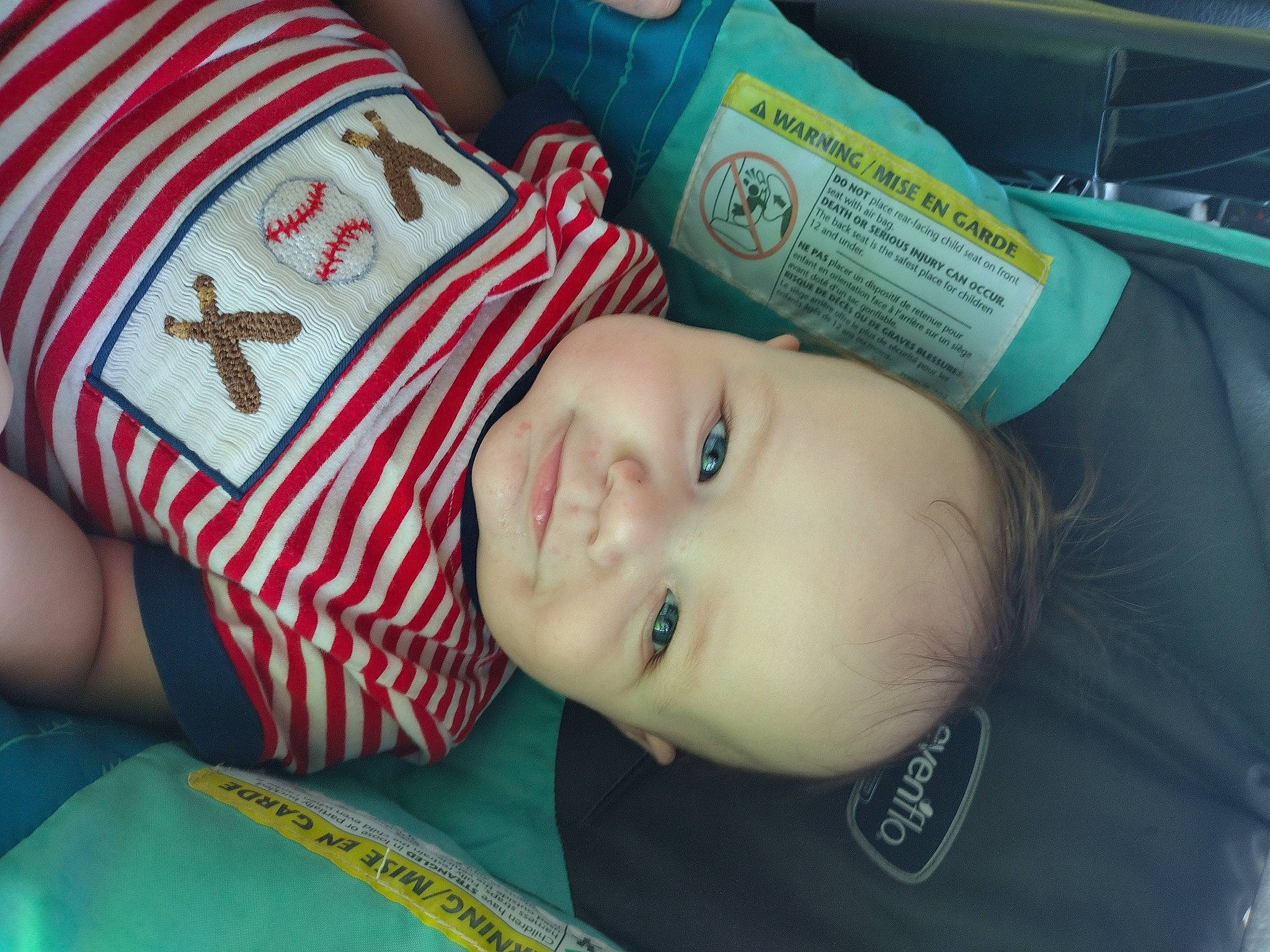 Dakota is registered to the contest to win money with this photo: baby, baby_products, baby_toddler_clothing, cheek, child, comfort, grass, happy, joy, linens, pattern, person, room, sitting, skin, sleeve, smile, toddler