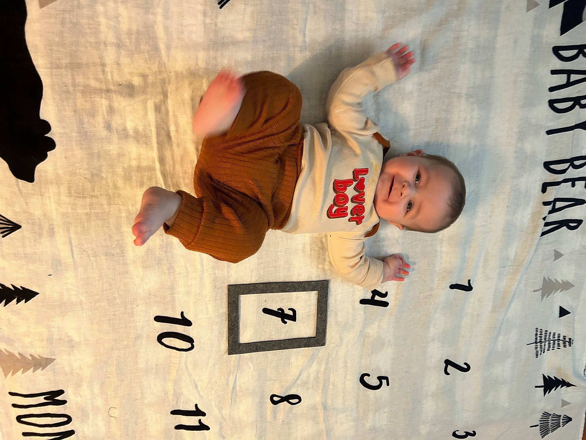 Braxton is registered to the contest to win money with this photo: baby_toddler_clothing, child, elbow, facial_expression, finger, font, fun, gesture, graphics, happy, human, joy, number, person, room, sleeve, symbol, t_shirt, thumb, toddler