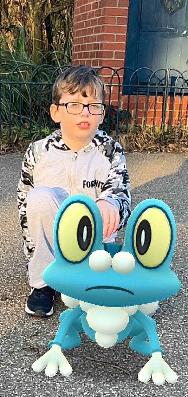 Harvey joined the competition — help win amazing prizes! animated_cartoon, cool, eye, eyewear, facial_expression, fence, fictional_character, fun, grass, happy, head, leisure, organ, person, photograph, plant, recreation, sitting, snapshot, t_shirt